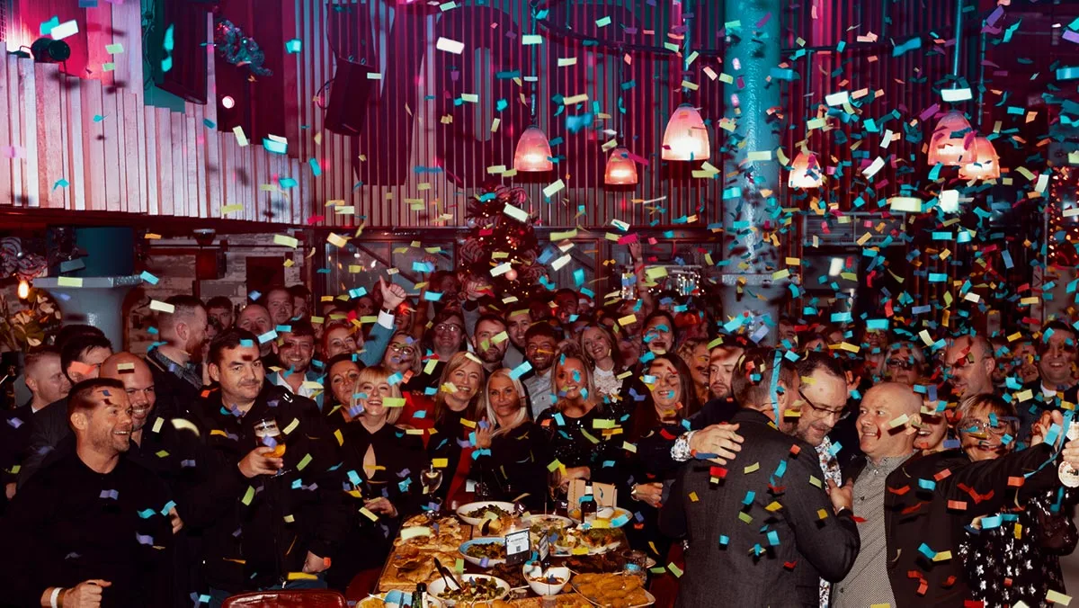 New Technology Group employees celebrating together