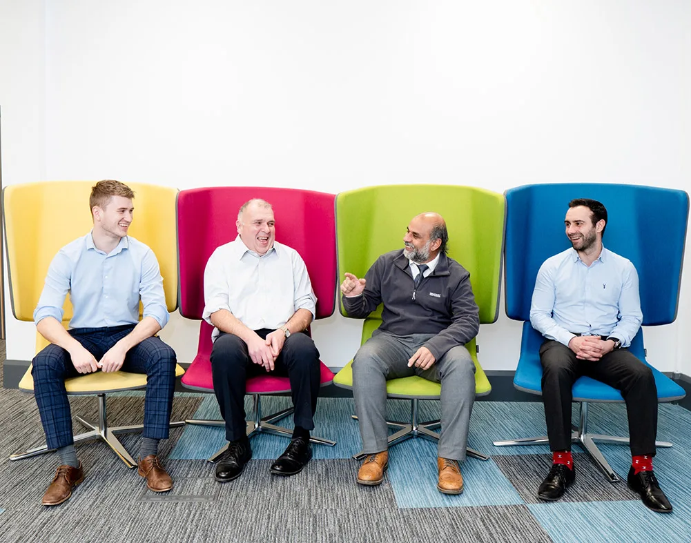 NIE Networks colleagues talking together in the office