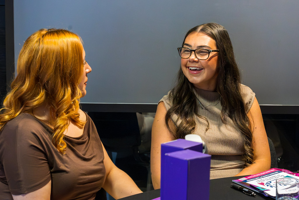 Colleagues in conversation at an Investors in People event