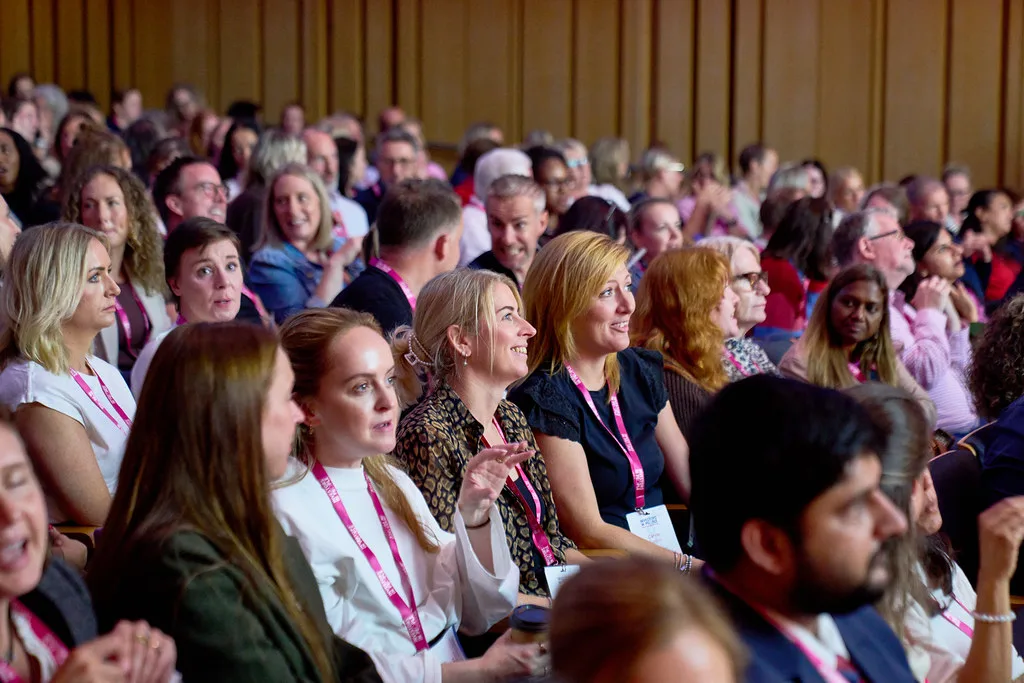 Delegates listening during a session