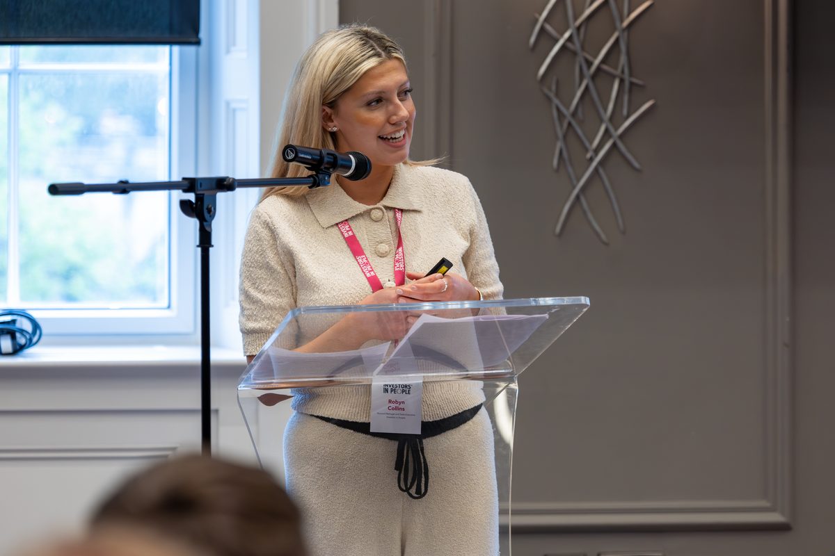 An Investors in People colleague speaking at an event