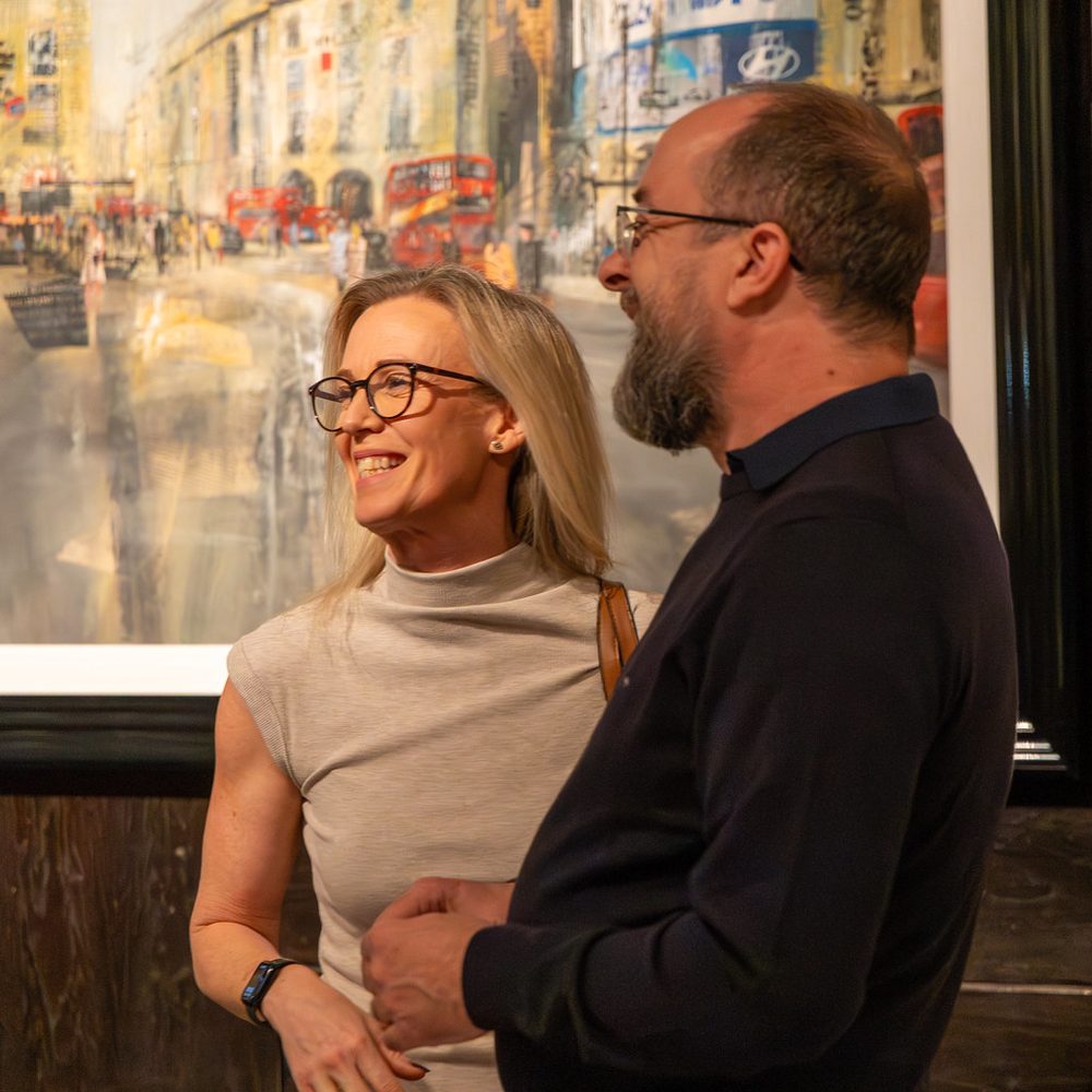 Two colleagues in conversation at an Investors in People event